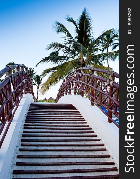 Staircase of the bridge under palm blue sky in summer