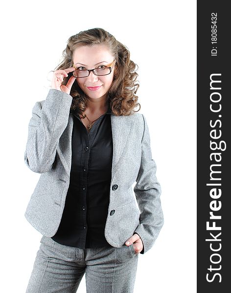 Beautiful young woman posing in business suit and glasses. Isolated over white background.