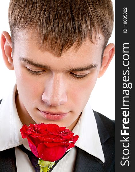 Man smelling a rose. Isolated