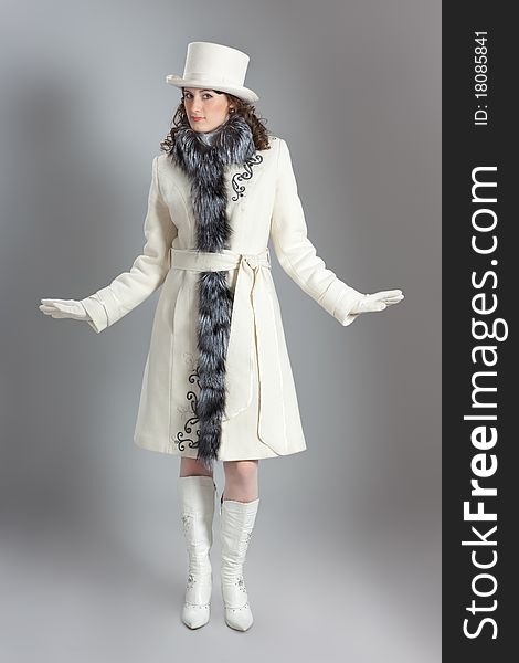 Girl in fur coat posing