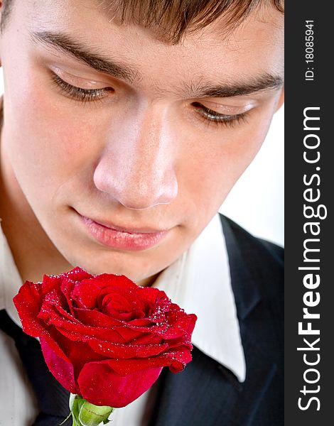 Man smelling a rose. Isolated