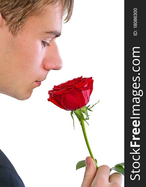 Man smelling a rose. Isolated