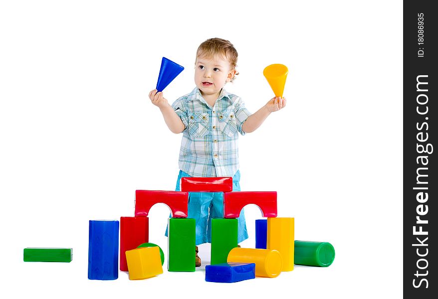 Cute little baby boy with colorful building blocks isolated on white