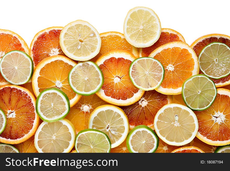 Slices of orange, lemon and limes - background, isolated on white