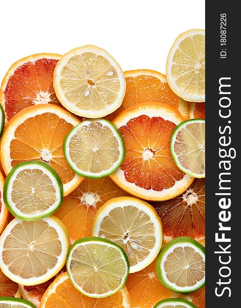 Slices of orange, lemon and limes - background, isolated on white