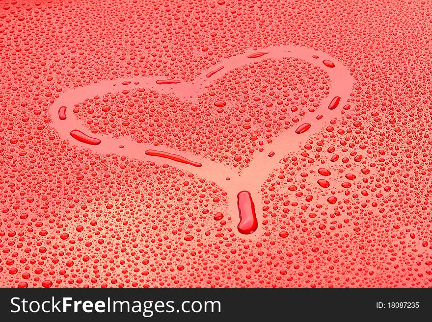 Heart drawn in drops o water on red background. Heart drawn in drops o water on red background