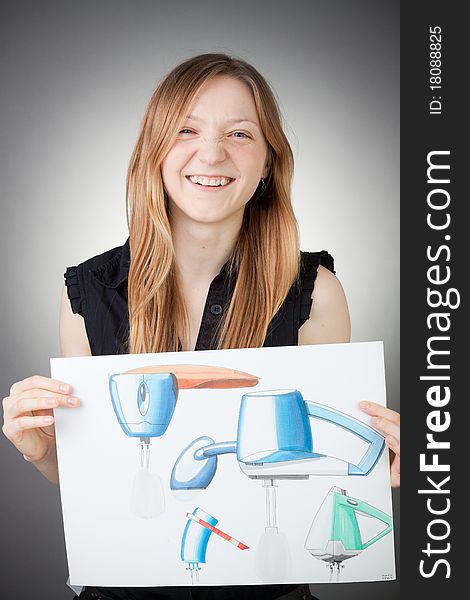 Young Design Engineer Woman Shows a Design Plan