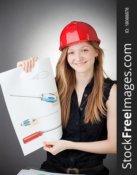 Young Design Engineer Woman Shows a Design Plan, with Grey Background