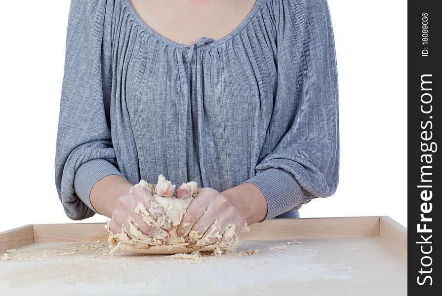 Pair of hands kneading pizza ( bread ) dough on wooden table. Pair of hands kneading pizza ( bread ) dough on wooden table.