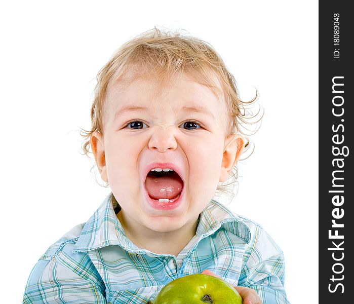 Beautiful baby boy eats green apple. Closeup portrait. Isolated.