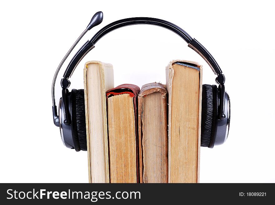 Books in headsets on a white background