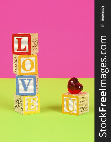Childrens blocks spell the words love you with bright colors. Childrens blocks spell the words love you with bright colors.