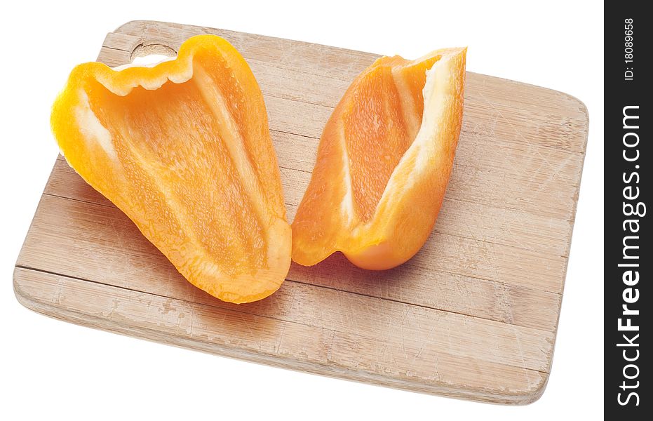 Sliced Orange Bell Peppers on a Wooden Chopping Block Isolated on White with a Clipping Path.