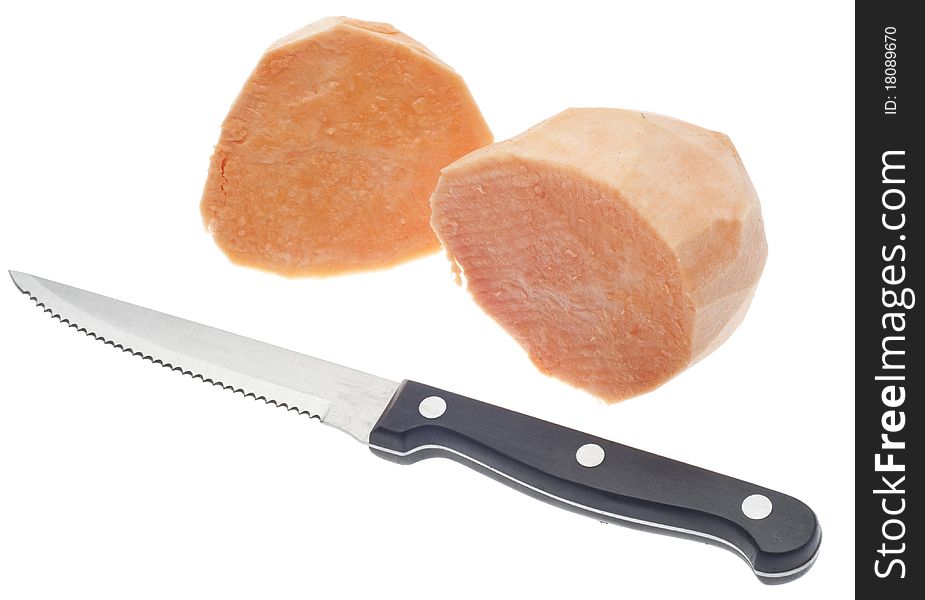 Sliced Sweet Potatoes with Knife Isolated on White with a Clipping Path.