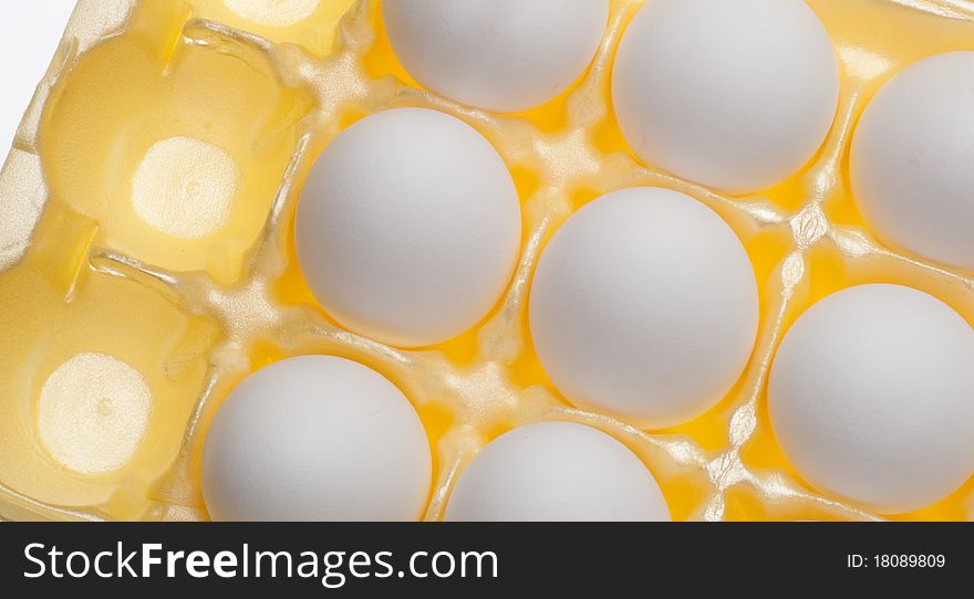 Carton of Eggs on Vibrant Yellow Modern Pattern.