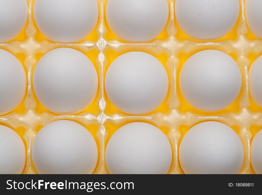 Carton of Eggs on Vibrant Yellow Modern Pattern.