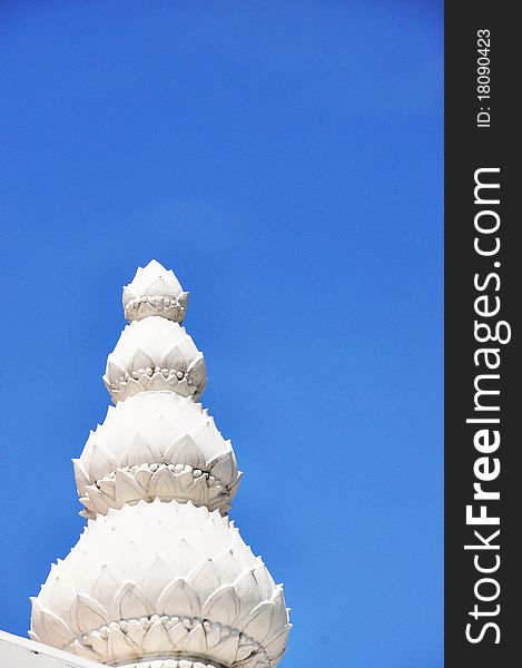 White lotus sculpture with blue sky