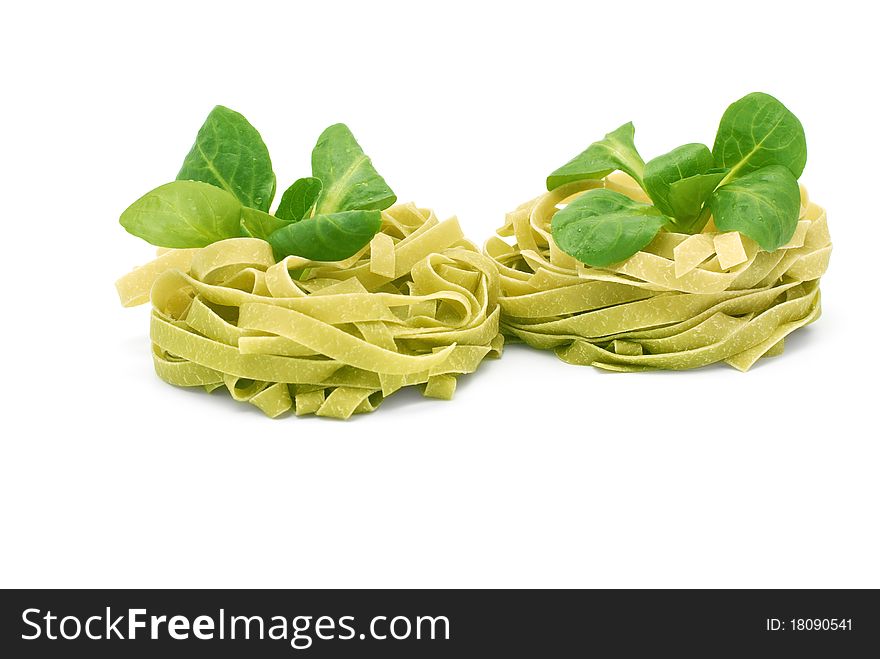 Italian pasta tagliatelle with corn salad on a white background