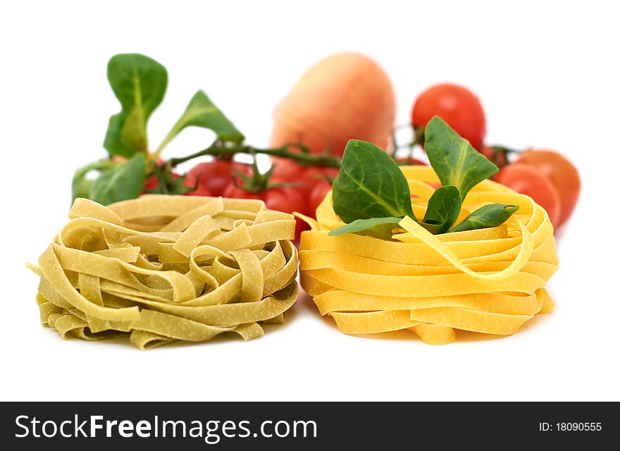 Italian pasta tagliatelle with vegetables on a white background