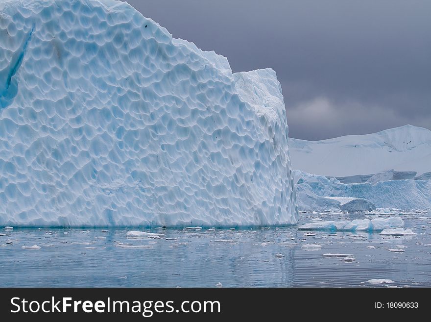 An iceberg is blue in the Antarctic waters