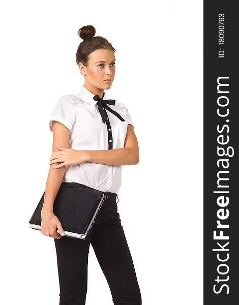 Woman standing and holding a laptop in hand on a white background, isolated picture