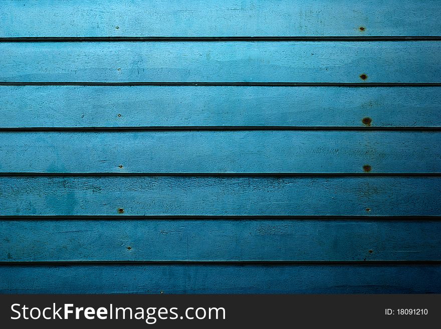 Close up of blue wooden well