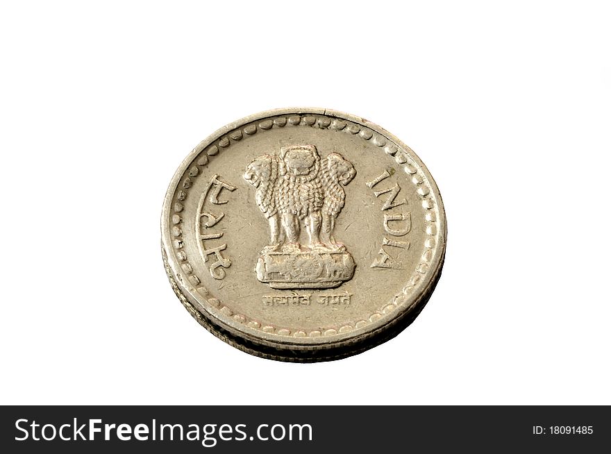 A five rupee coin isolated on a white background. A five rupee coin isolated on a white background