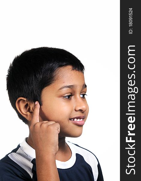 An handsome young indian kid thinking about something