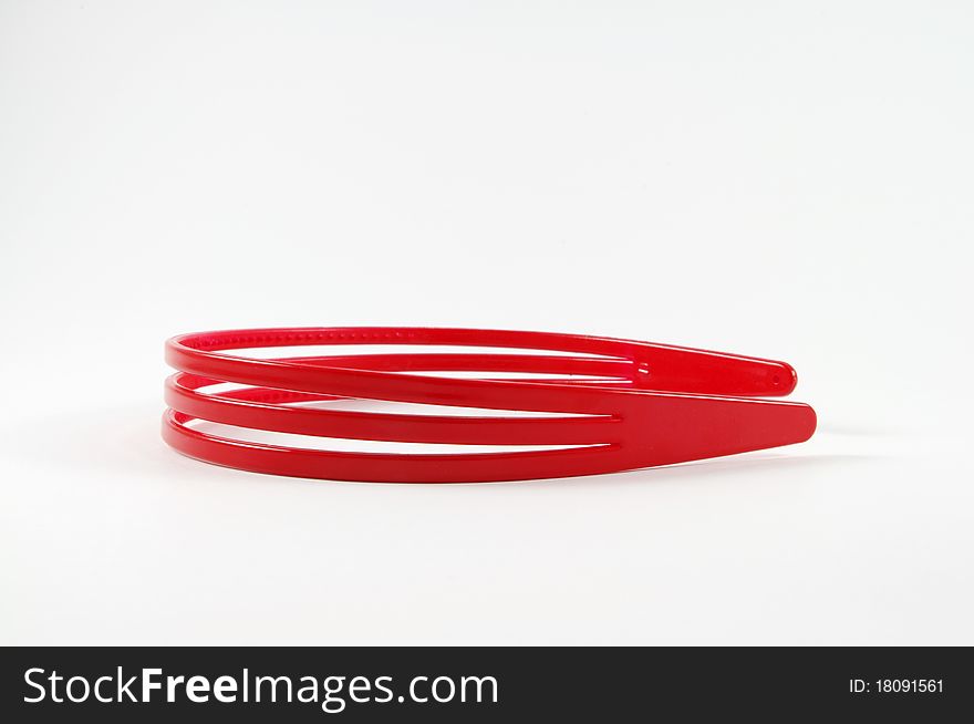 Red girl's hair holder isolated on background. Red girl's hair holder isolated on background