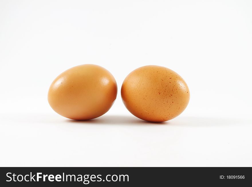 Two nice eggs lying on the isolated surface. Two nice eggs lying on the isolated surface