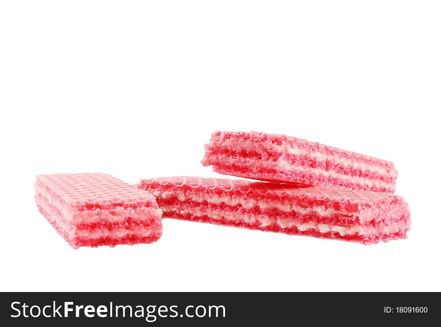 Three red strawberry wafers on white isolated surface