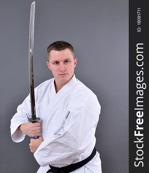 Karate man with single edged Japanese sword