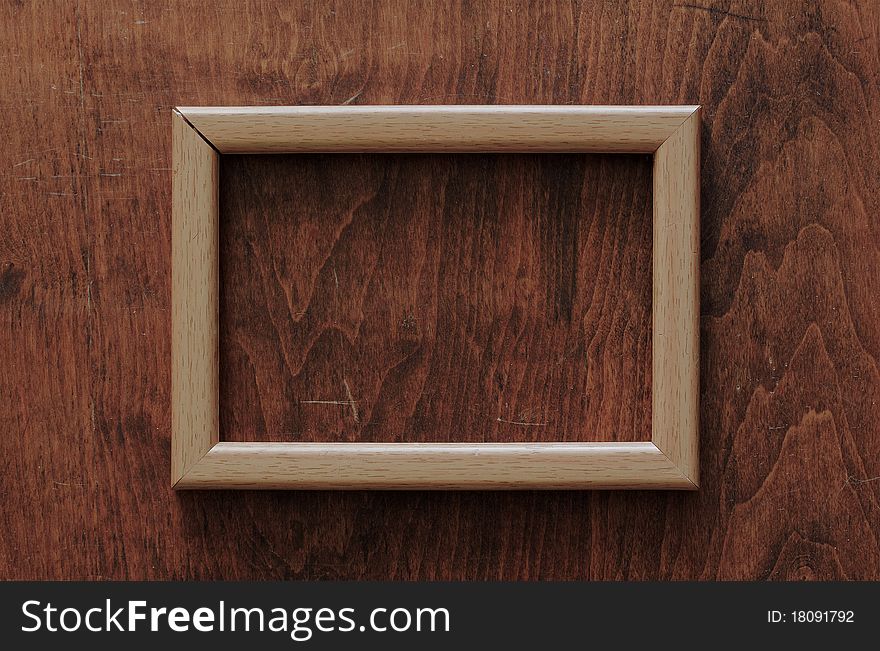 Blank frame on old wooden background