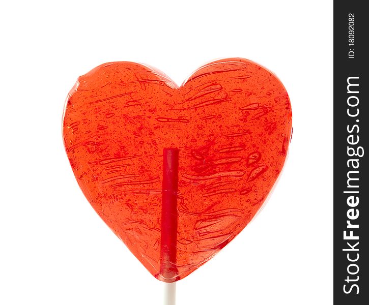 Candy heart on a stick on a white background