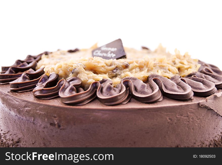 German chocolate cake with cocoa on a white background