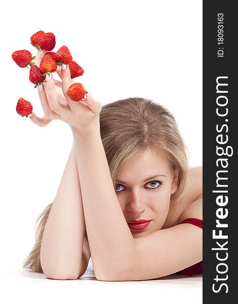 young woman with red strawberries picked on fingertips isolated on white background