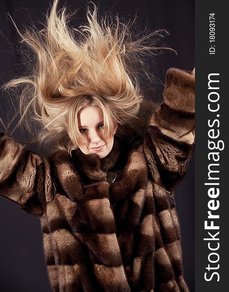 Attractive woman in fur sheepskin jacket. Attractive woman in fur sheepskin jacket