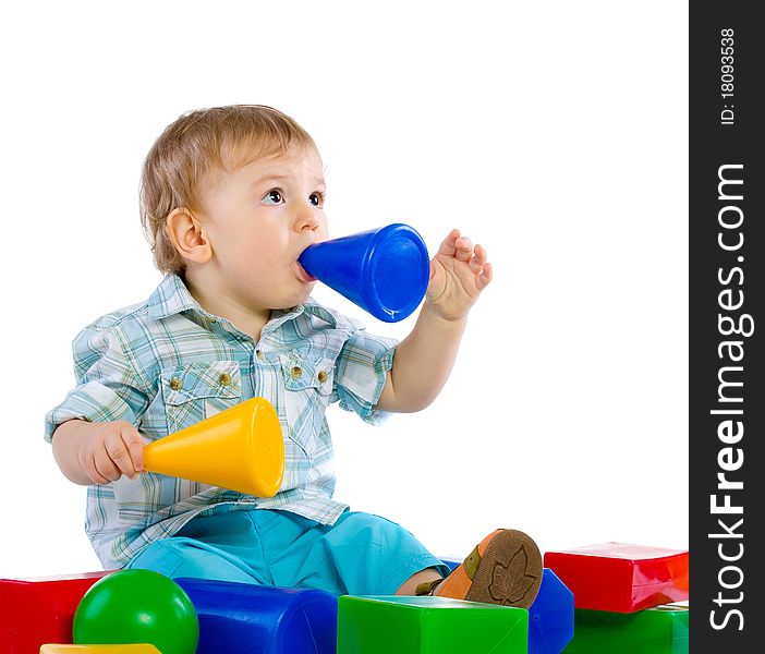 Cute little baby boy with colorful building blocks isolated on white