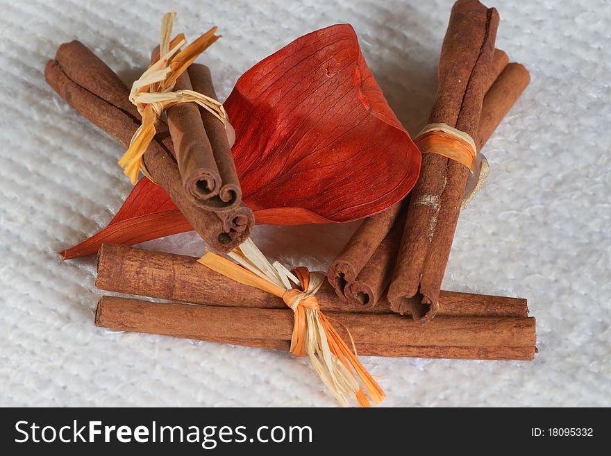 Pieces of cinnamon with a leaf