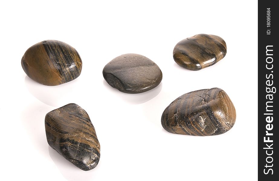 FIVE STACKED SHINY BROWN STONES. FIVE STACKED SHINY BROWN STONES