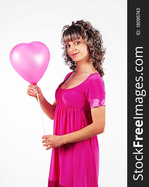 Young beautiful girl holding a balloon heart, love, Valentine's Day holiday