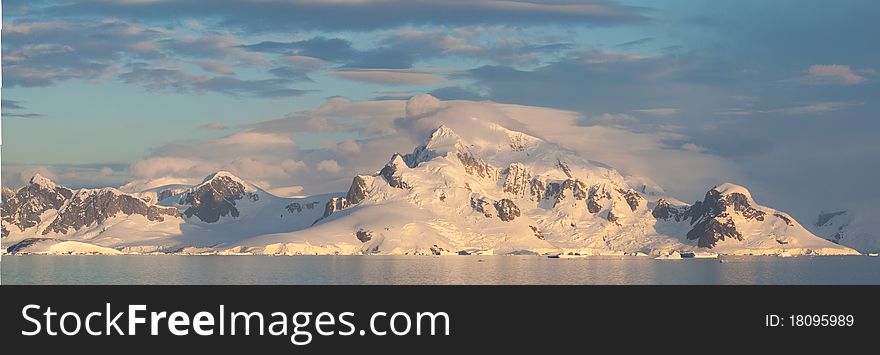 The seascape of antarctica backdropped with glaciers and mountains. The seascape of antarctica backdropped with glaciers and mountains