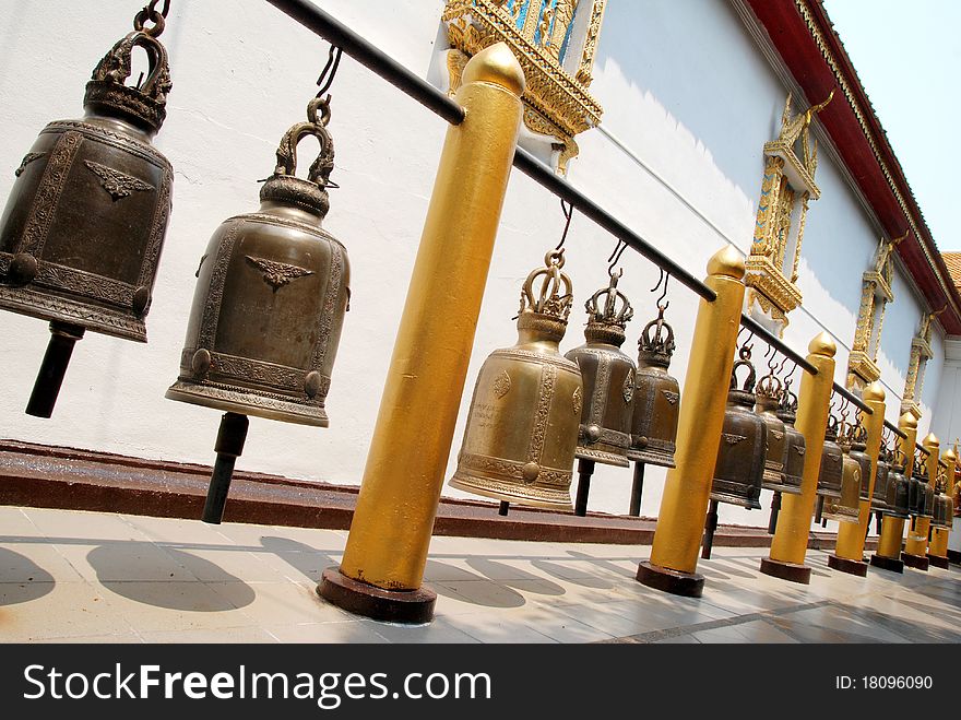 Bronze bells in Doi Suthep buddhist temple in Chiang Mai, Thailand. Bronze bells in Doi Suthep buddhist temple in Chiang Mai, Thailand