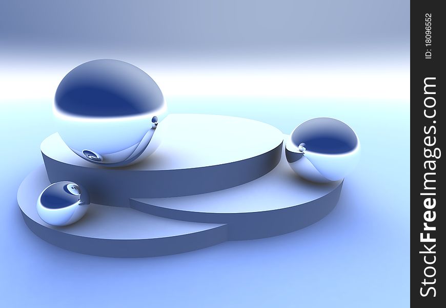 Three spheres on a pedestal look against each other