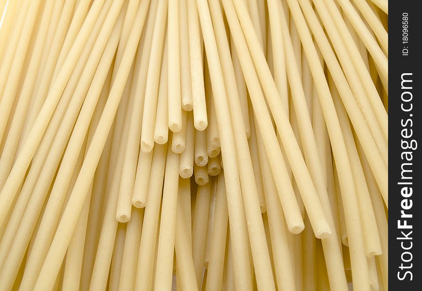 A considerable quantity of crude spaghettis create a beautiful background. A considerable quantity of crude spaghettis create a beautiful background