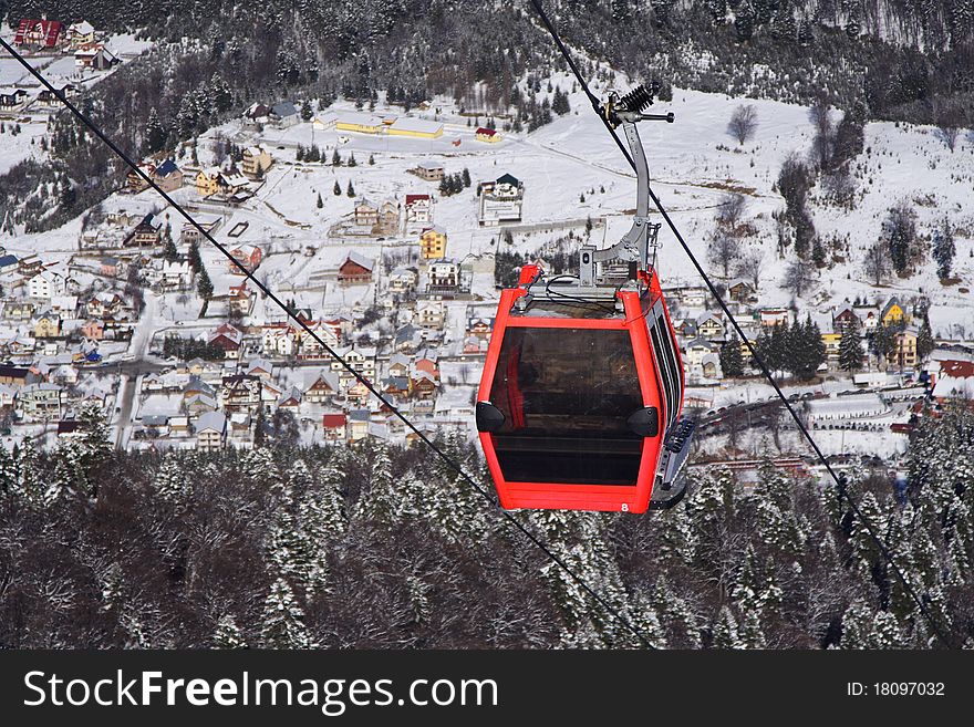 Cable gondolas with winter background