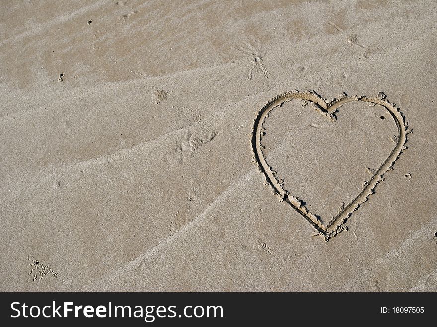 This heart is write by hand on the beach. This heart is write by hand on the beach.
