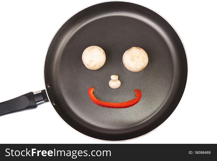 Smile from mushrooms and pepper on a frying pan