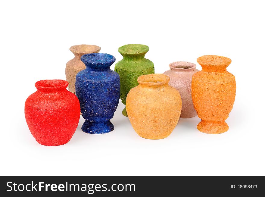 Seven multicolored vases. Isolated on white