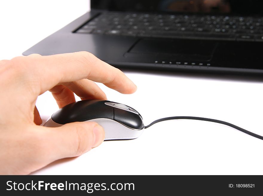 Hand clicking computer mouse isolated on white